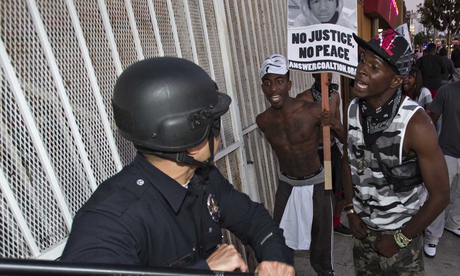 Protesters confront police following George Zimmerman's acquittal for the killing of Trayvon Martin.
